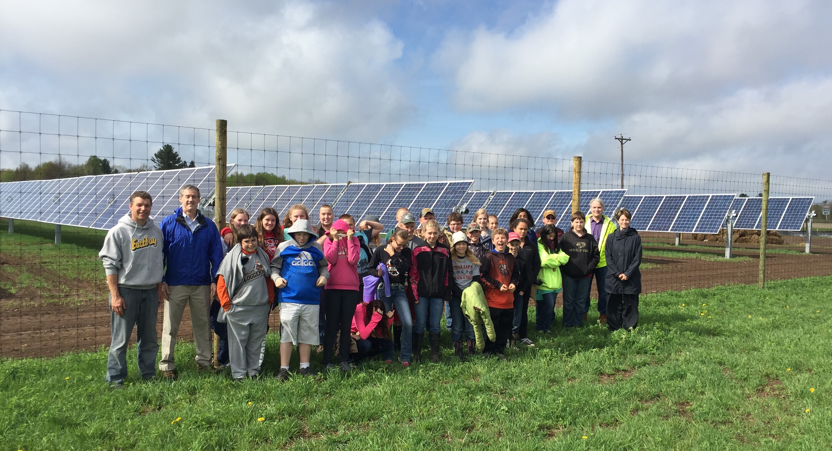 people gathered at solar array